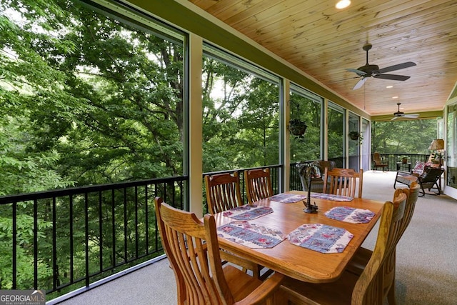 sunroom with outdoor dining space and ceiling fan