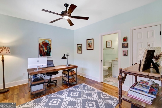 home office with ceiling fan, wood finished floors, and baseboards