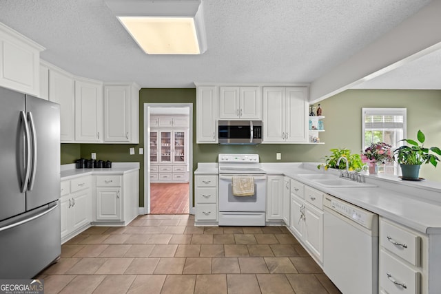 233 Clark Rd, Midville, GA 30441 - kitchen with appliances with stainless steel finishes, a sink, white cabinetry, light countertops, and open shelves