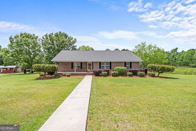 233 Clark Rd, Midville, GA 30441 - ranch-style home with a front yard and brick siding