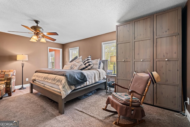 233 Clark Rd, Midville, GA 30441 - bedroom with carpet floors, a textured ceiling, and a ceiling fan