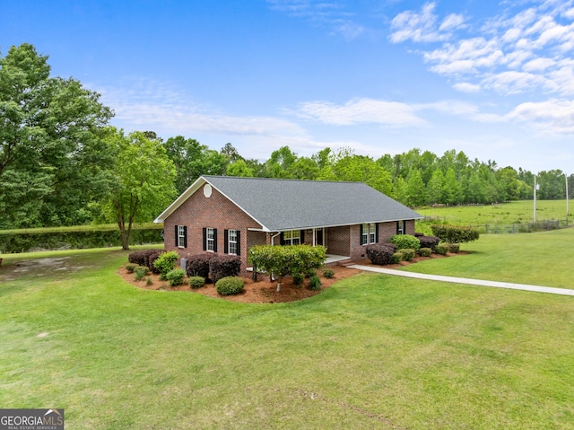 233 Clark Rd, Midville, GA 30441 - view of front of home with brick siding, a front yard, and a shingled roof