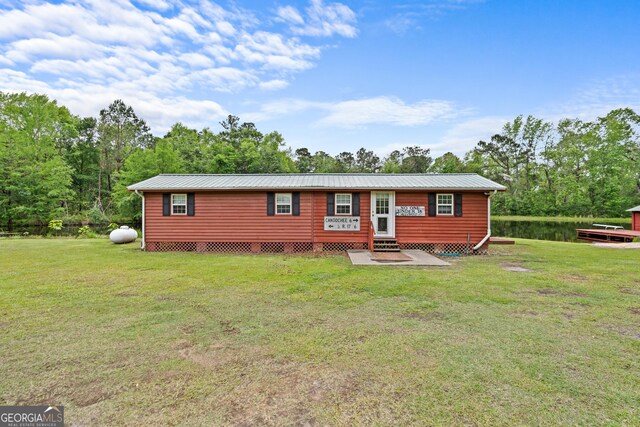 233 Clark Rd, Midville, GA 30441 - view of front facade featuring entry steps, a front yard, and metal roof