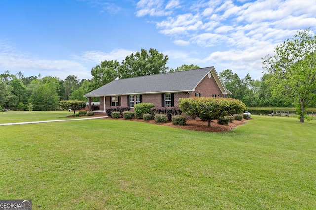 233 Clark Rd, Midville, GA 30441 - view of front of home featuring brick siding, a front yard, and a shingled roof