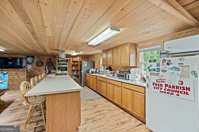 233 Clark Rd, Midville, GA 30441 - kitchen featuring stainless steel appliances, wooden ceiling, light wood-type flooring, wooden walls, and light countertops