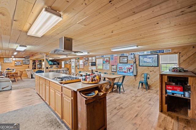 233 Clark Rd, Midville, GA 30441 - kitchen featuring wooden ceiling, wooden walls, light wood-style floors, stainless steel gas cooktop, and a kitchen island