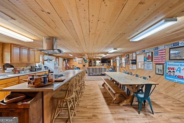 233 Clark Rd, Midville, GA 30441 - dining space with wood ceiling, light wood finished floors, and wooden walls