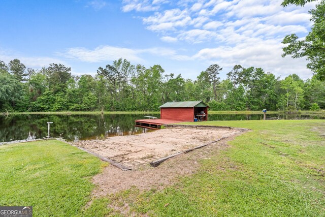 233 Clark Rd, Midville, GA 30441 - view of grassy yard with a water view, a wooded view, and an outdoor structure