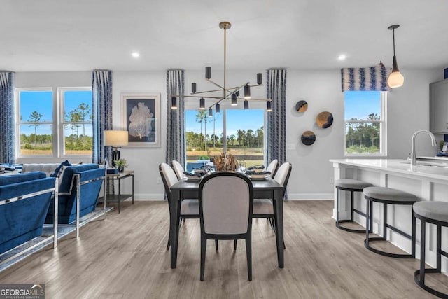 508 Regency Trl, Acworth, GA 30102 - dining space featuring a chandelier, baseboards, light wood finished floors, and recessed lighting