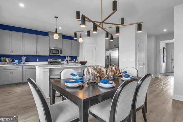 508 Regency Trl, Acworth, GA 30102 - dining room featuring light wood-style flooring, recessed lighting, and baseboards