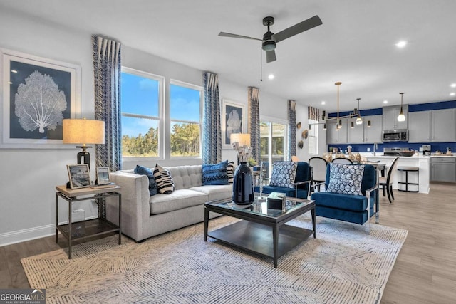 508 Regency Trl, Acworth, GA 30102 - living area with a ceiling fan, light wood-style floors, recessed lighting, and baseboards