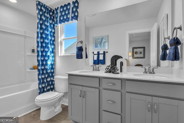 508 Regency Trl, Acworth, GA 30102 - full bathroom with toilet, double vanity, shower / tub combo, and wood finished floors