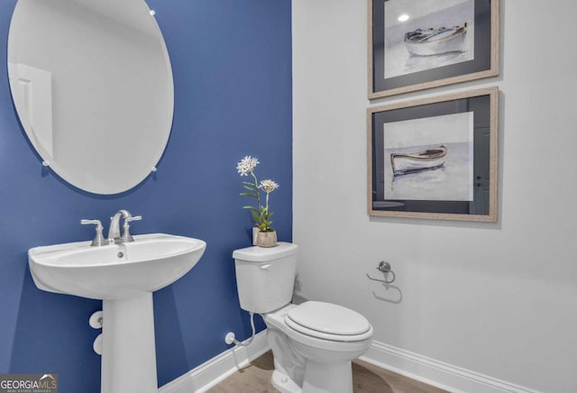 508 Regency Trl, Acworth, GA 30102 - bathroom with baseboards, toilet, and wood finished floors
