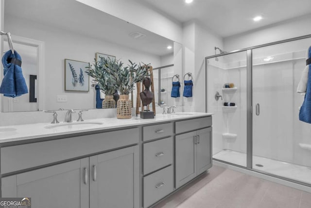508 Regency Trl, Acworth, GA 30102 - bathroom featuring a stall shower, double vanity, recessed lighting, and tile patterned flooring