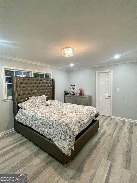 1838 Cates Ct, Snellville, GA 30078 - bedroom with light wood-style flooring, baseboards, ornamental molding, and recessed lighting
