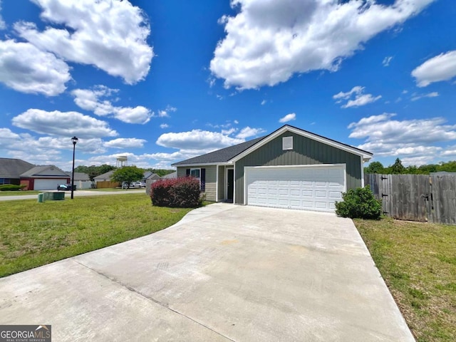 ranch-style home with a garage and concrete driveway