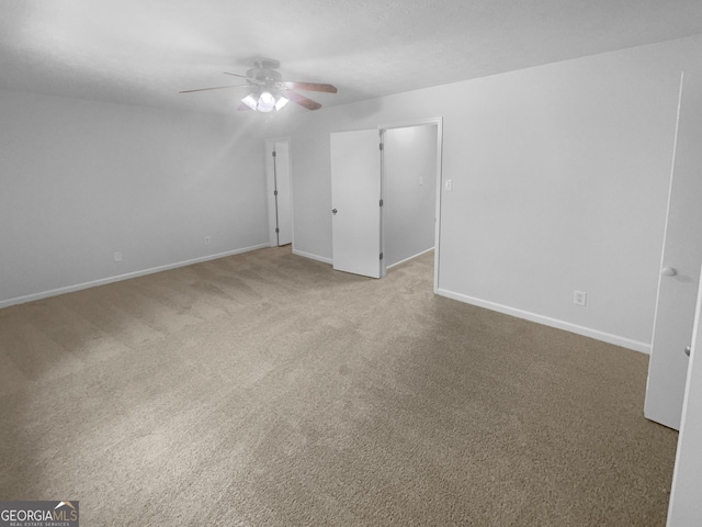 4504 Cedar Ridge Trl, Stone Mountain, GA 30083 - unfurnished bedroom featuring baseboards, light colored carpet, ceiling fan, and a walk in closet