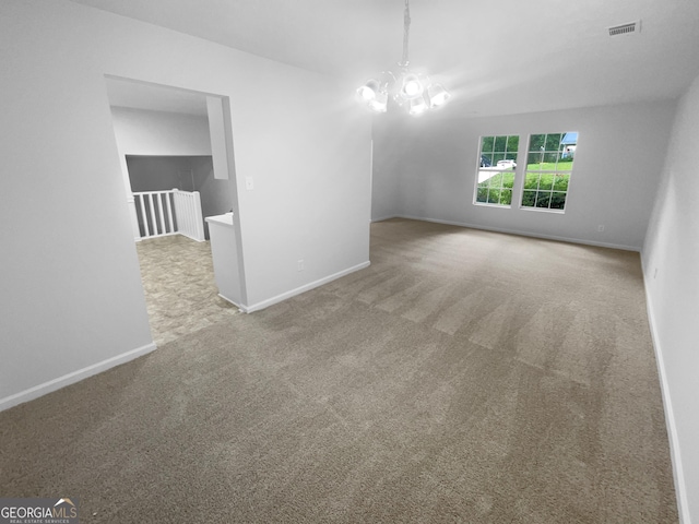 4504 Cedar Ridge Trl, Stone Mountain, GA 30083 - carpeted empty room with a chandelier and baseboards