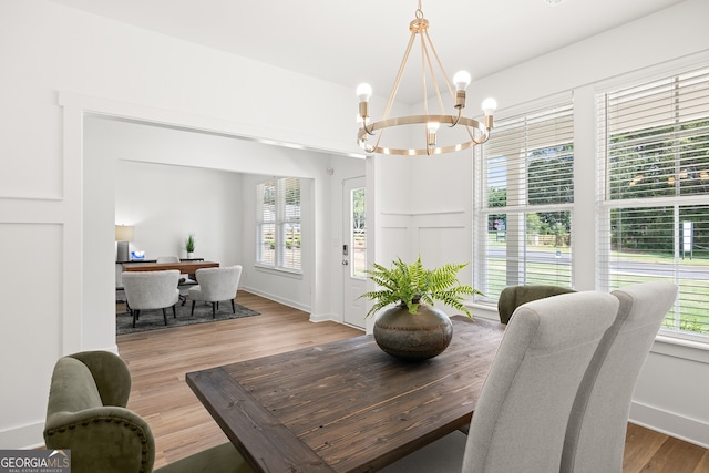dining room featuring a chandelier and wood finished floors