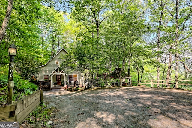 view of front of property featuring fence