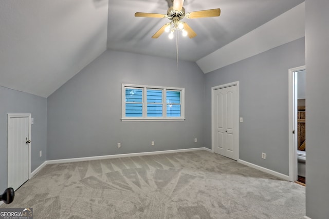 bonus room with vaulted ceiling, carpet, ceiling fan, and baseboards