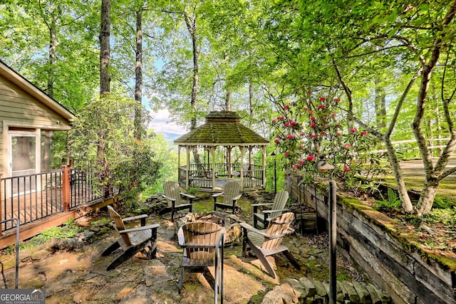 view of yard featuring a gazebo and a fire pit