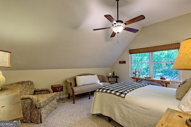 bedroom featuring carpet, vaulted ceiling, and a ceiling fan