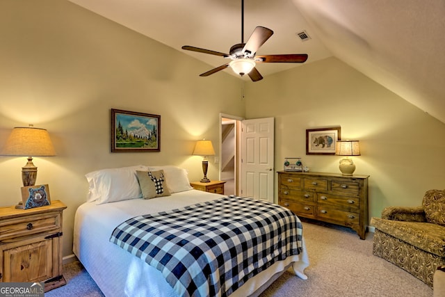 bedroom featuring carpet, vaulted ceiling, and ceiling fan
