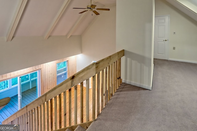 corridor with carpet flooring, an upstairs landing, and baseboards