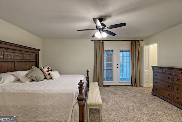 bedroom featuring light colored carpet, access to outside, a ceiling fan, and french doors