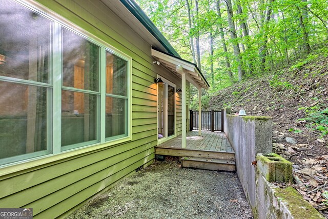 view of property exterior featuring a deck