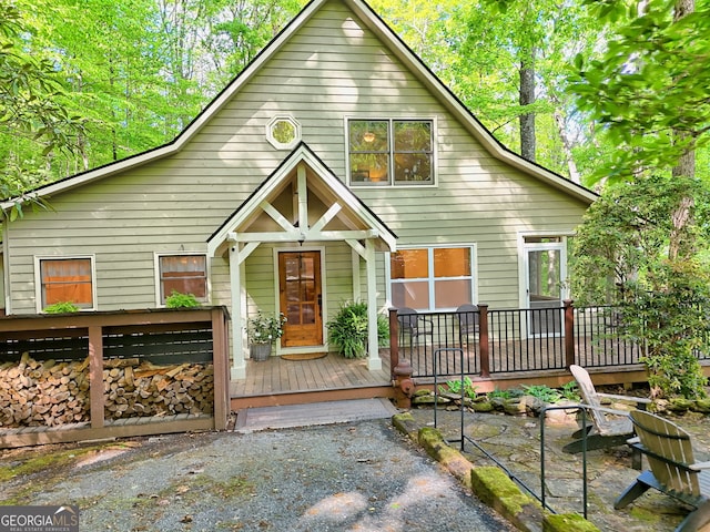 view of front facade with a wooden deck