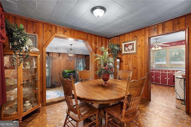 413 New Town Rd NE, Calhoun, GA 30701 - dining area featuring wooden walls, arched walkways, and a chandelier