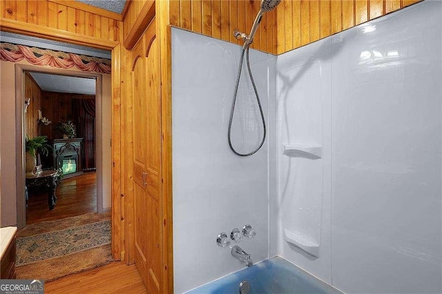 413 New Town Rd NE, Calhoun, GA 30701 - bathroom with wooden walls, shower / bathtub combination, and wood finished floors