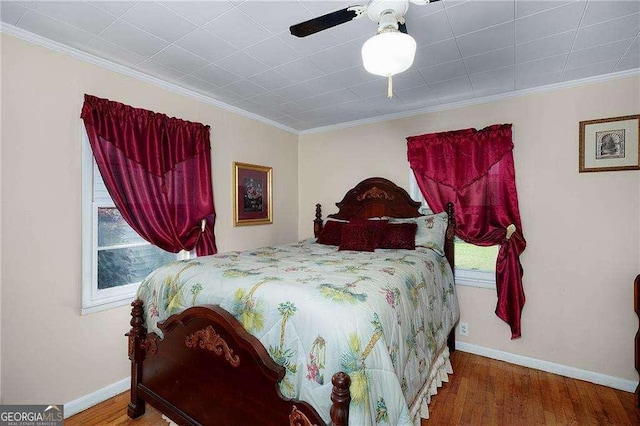 413 New Town Rd NE, Calhoun, GA 30701 - bedroom with ornamental molding, wood finished floors, baseboards, multiple windows, and ceiling fan