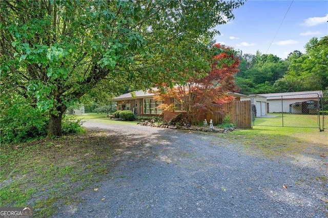 413 New Town Rd NE, Calhoun, GA 30701 - view of property hidden behind natural elements featuring fence and gravel driveway