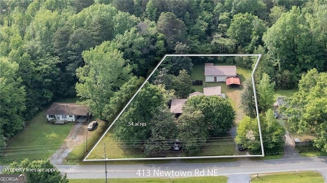 413 New Town Rd NE, Calhoun, GA 30701 - aerial overview of property's location with property boundaries highlighted and a heavily wooded area