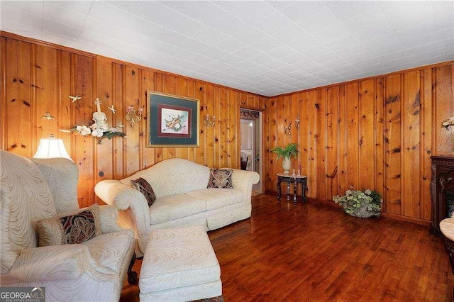 413 New Town Rd NE, Calhoun, GA 30701 - living room featuring wood walls, wood finished floors, and baseboards