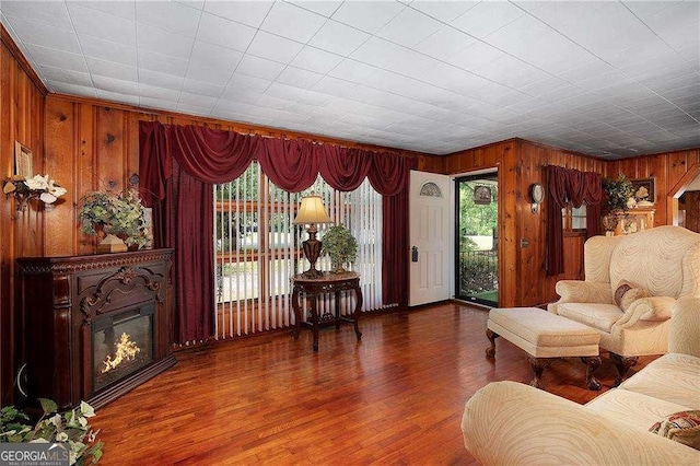 413 New Town Rd NE, Calhoun, GA 30701 - living area featuring wooden walls, wood finished floors, and a glass covered fireplace