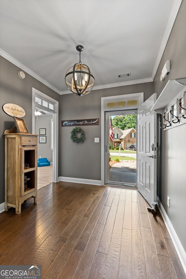 58 Gables Way, Newnan, GA 30265 - foyer entrance with a chandelier, hardwood / wood-style flooring, ornamental molding, and baseboards