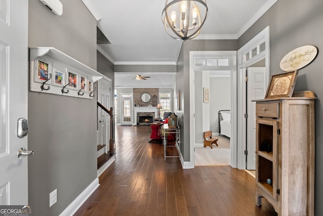 58 Gables Way, Newnan, GA 30265 - entryway with baseboards, dark wood-style floors, crown molding, a fireplace, and ceiling fan