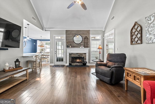 58 Gables Way, Newnan, GA 30265 - living area with lofted ceiling, ceiling fan, a stone fireplace, dark wood finished floors, and crown molding