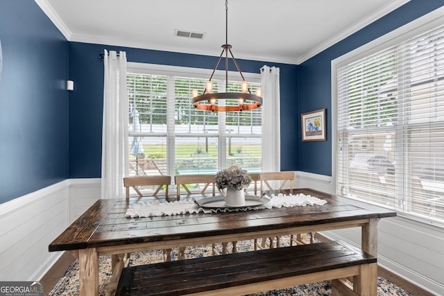 58 Gables Way, Newnan, GA 30265 - dining area featuring a chandelier, wood finished floors, crown molding, and wainscoting
