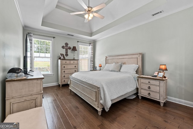 58 Gables Way, Newnan, GA 30265 - bedroom with a raised ceiling, crown molding, dark wood finished floors, baseboards, and a ceiling fan