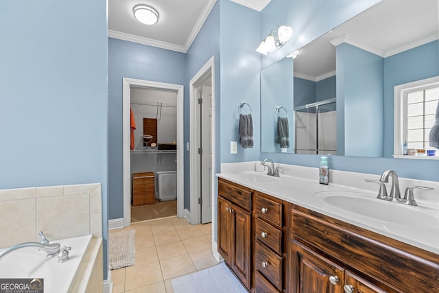 58 Gables Way, Newnan, GA 30265 - full bathroom with double vanity, tile patterned flooring, crown molding, a shower stall, and a walk in closet