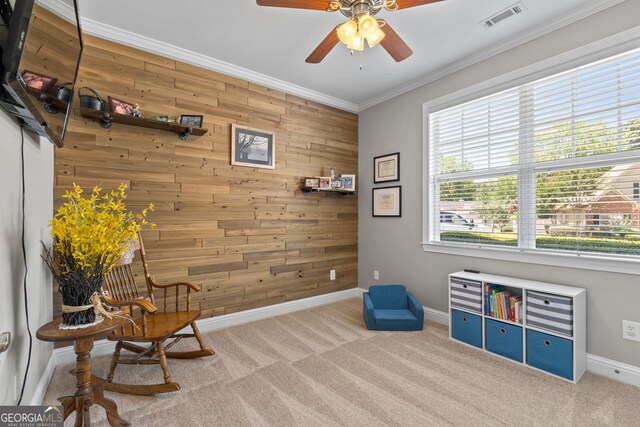 58 Gables Way, Newnan, GA 30265 - sitting room featuring wood walls, ceiling fan, ornamental molding, baseboards, and carpet flooring