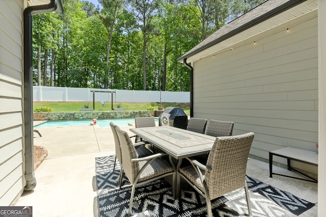 58 Gables Way, Newnan, GA 30265 - view of patio / terrace with a fenced backyard, outdoor dining space, and area for grilling