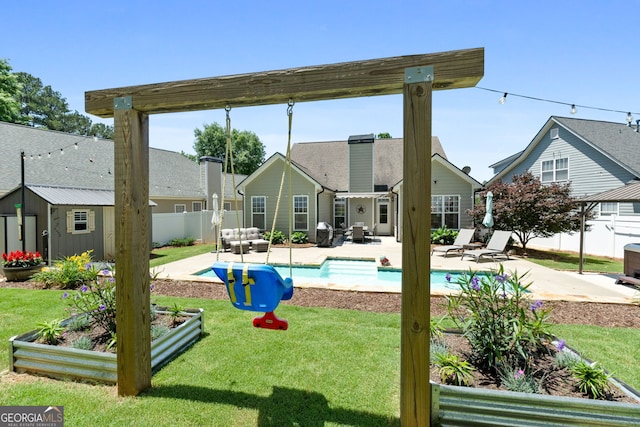 58 Gables Way, Newnan, GA 30265 - rear view of house featuring a patio area and an outbuilding