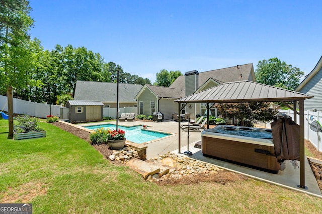 58 Gables Way, Newnan, GA 30265 - view of pool featuring a hot tub, a gazebo, a patio, a shed, and an outbuilding