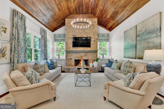 living room with wooden ceiling, plenty of natural light, a chandelier, a fireplace, and high vaulted ceiling